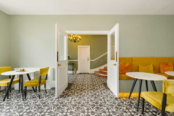 Stylish seating area in The Abbey London Lobby.
